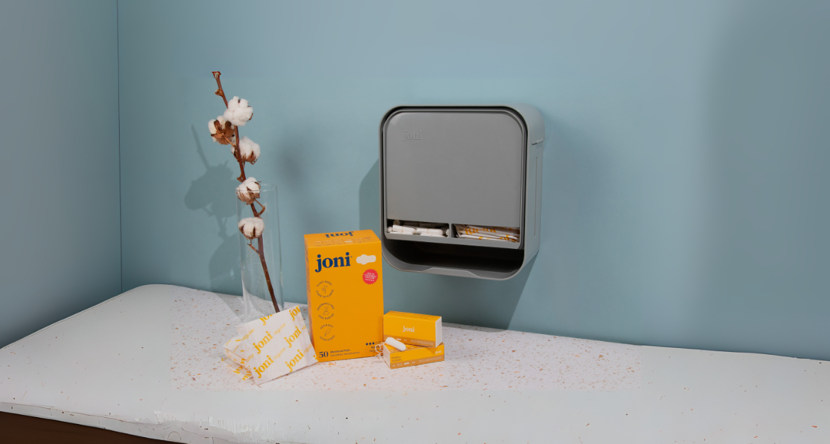 joni Model A open dispenser hanging on a wall
