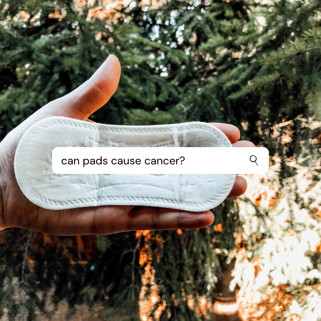 Hand holding a feminine pad with the text 'can pads cause cancer?' illustrating concerns about period care.