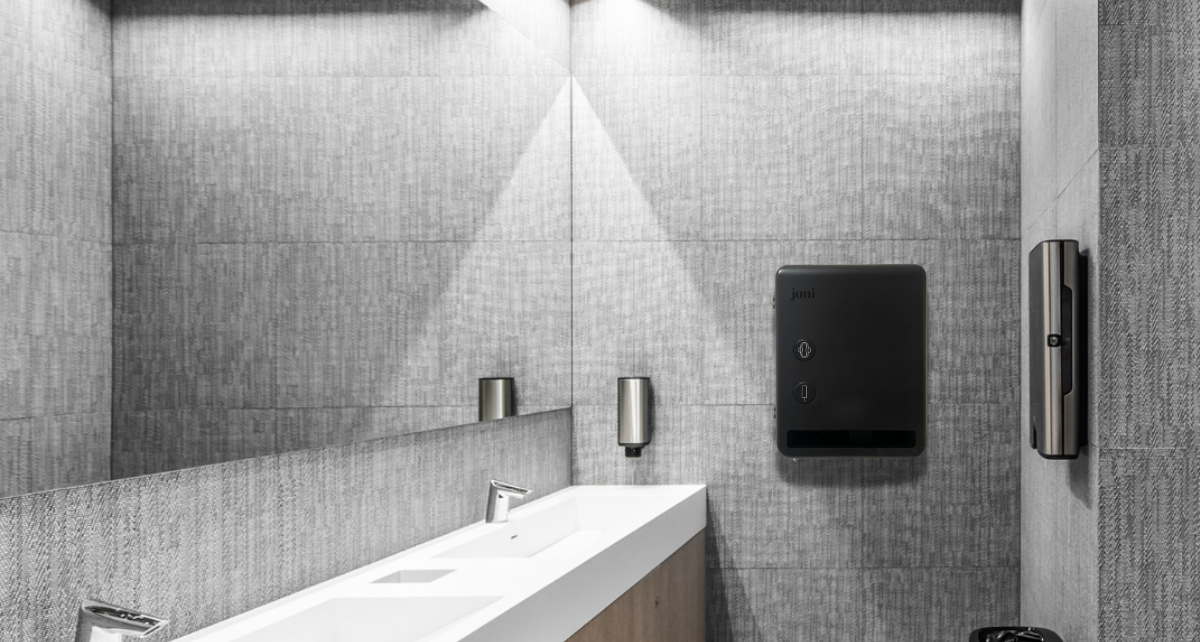 joni Model V period care dispenser in a commercial washroom setting