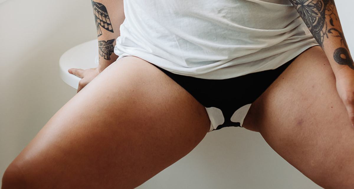 Woman in underwear with pad with wings