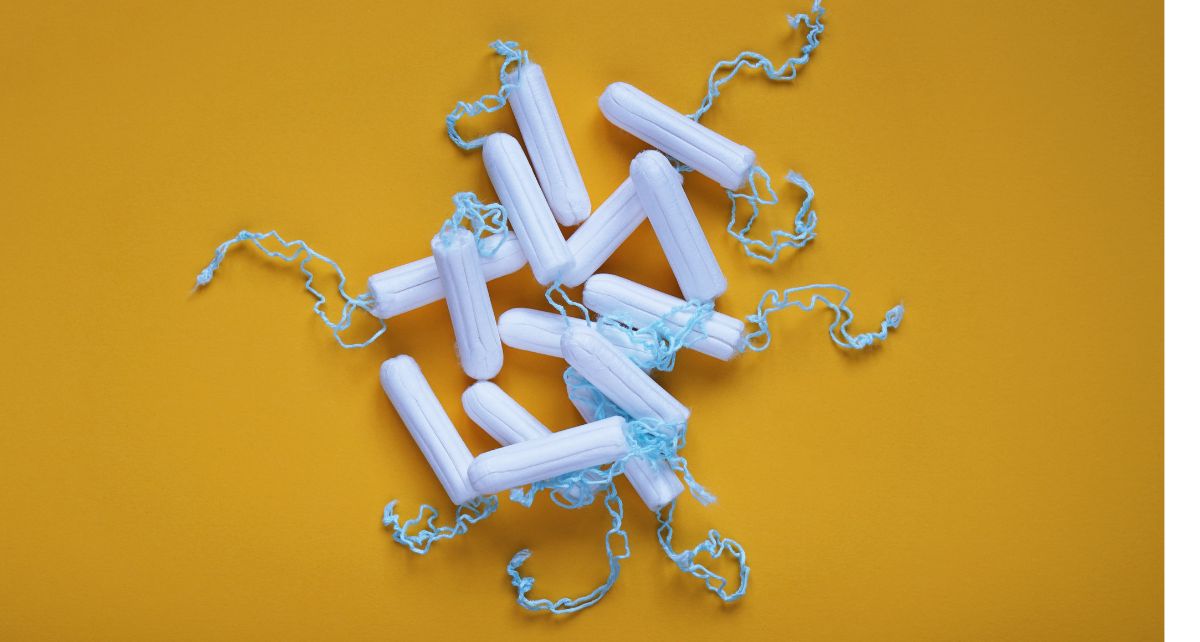 A pile of applicator-free tampons on a yellow background