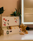 Retro Period Care Bundle displayed on a vanity with plants and a cute star plush toy.