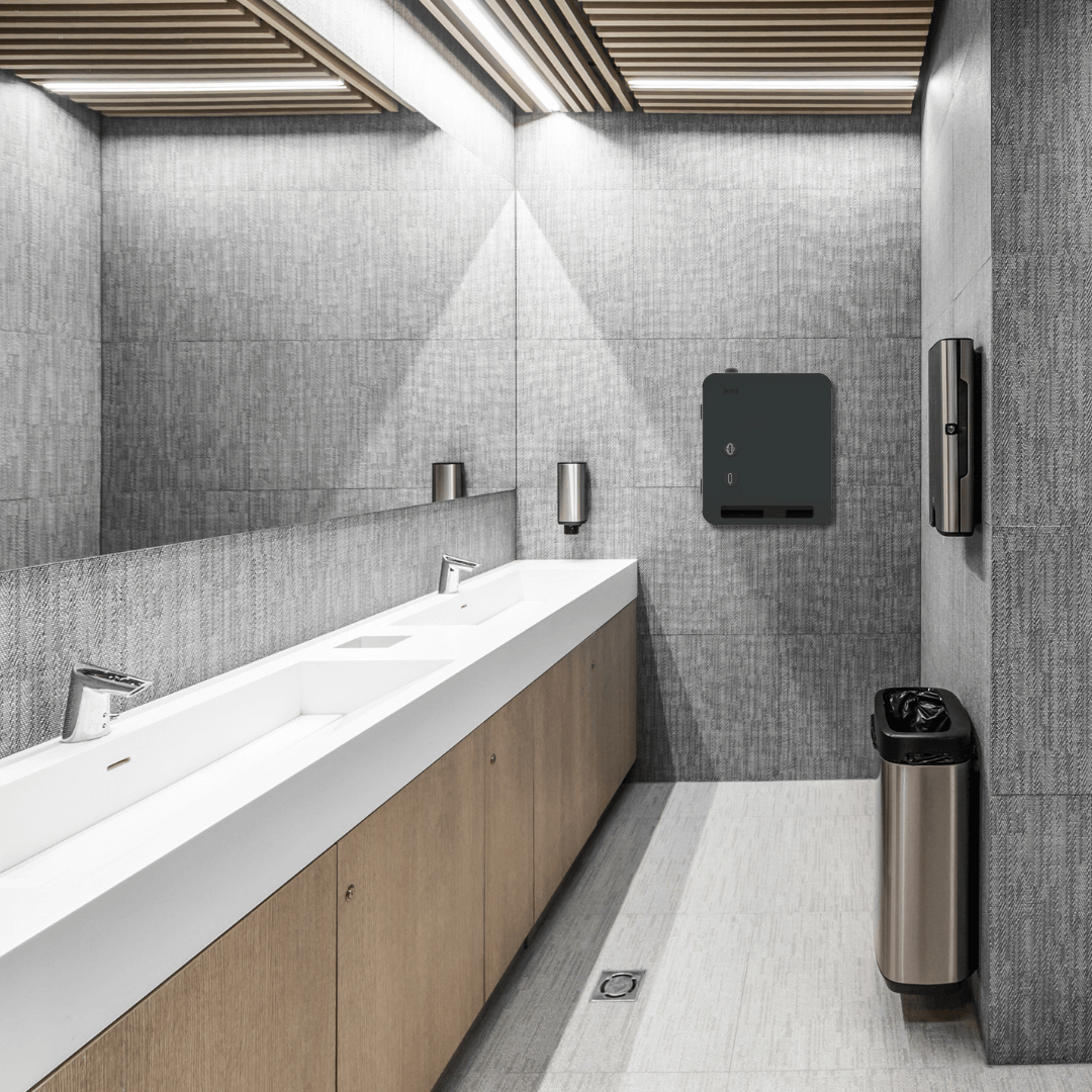 Modern restroom featuring Model V Smart Free-vend Period Care Dispenser on the wall.
