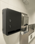 Smart Free-vend Period Care Dispenser Model V mounted on a restroom wall for touchless menstrual care access.