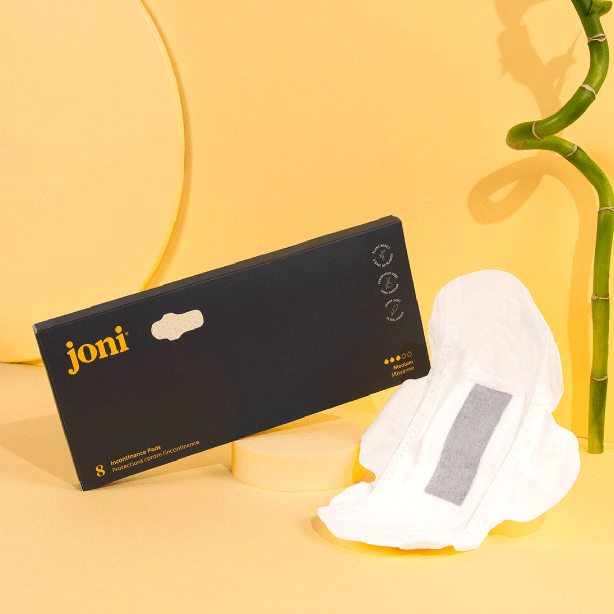 Bamboo incontinence pads by joni, with a sleek packaging and pad displayed on a yellow background.