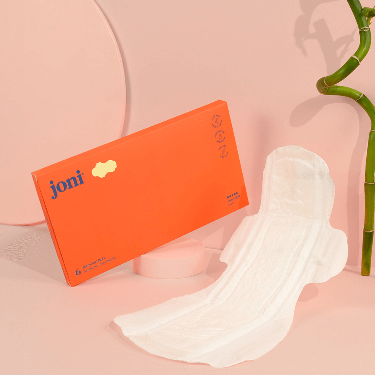 Postpartum Period Care Bundle by joni with soft bamboo pads for comfort and absorbency on pink background.