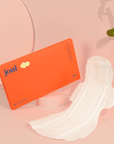 Postpartum Period Care Bundle by joni with soft bamboo pads for comfort and absorbency on pink background.
