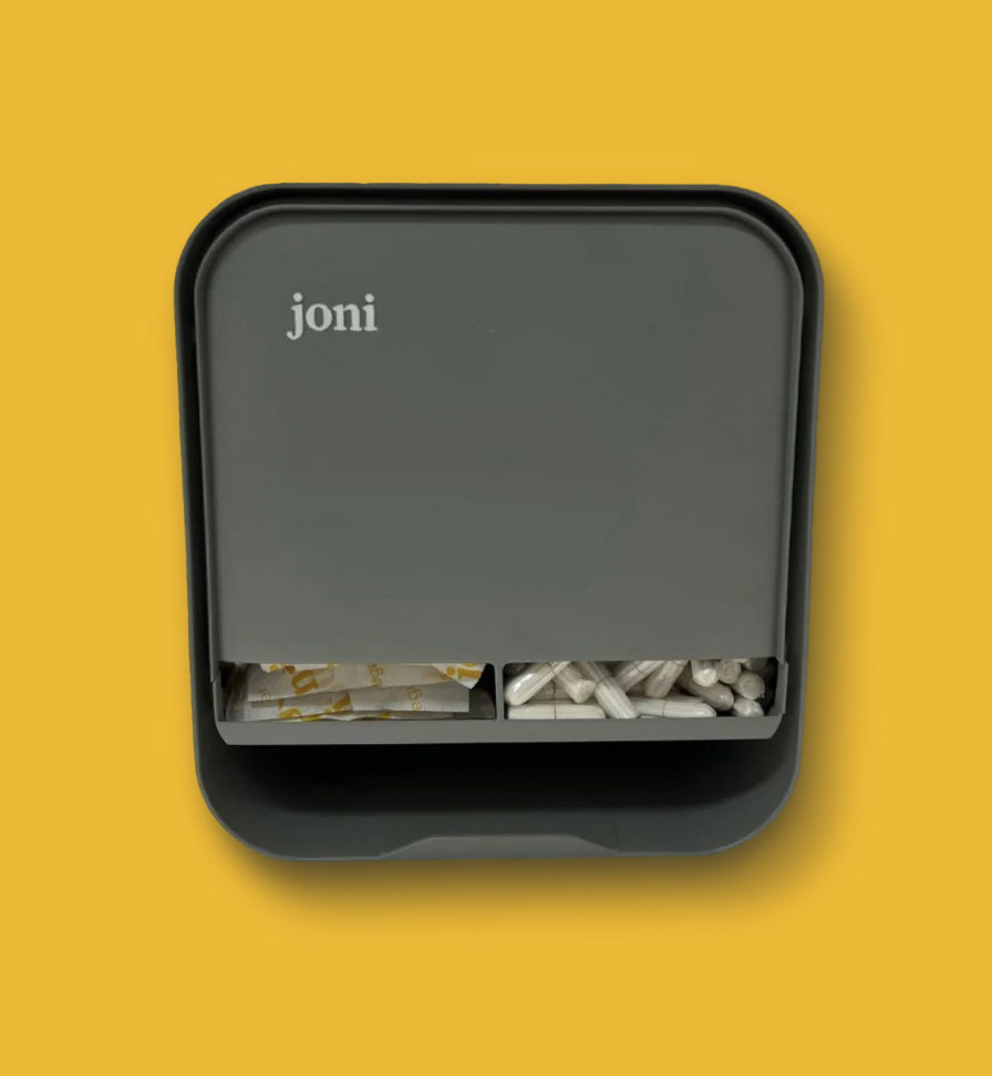 joni menstrual dispenser with non-applicator tampons on a vibrant yellow background.