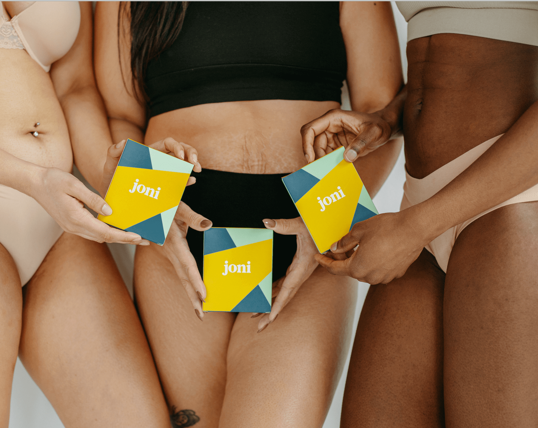 Three individuals holding joni boxes, promoting menstrual health and period products for women.