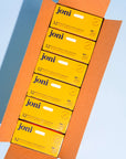Open casepack of joni regular tampons for commercial washrooms with a blue background