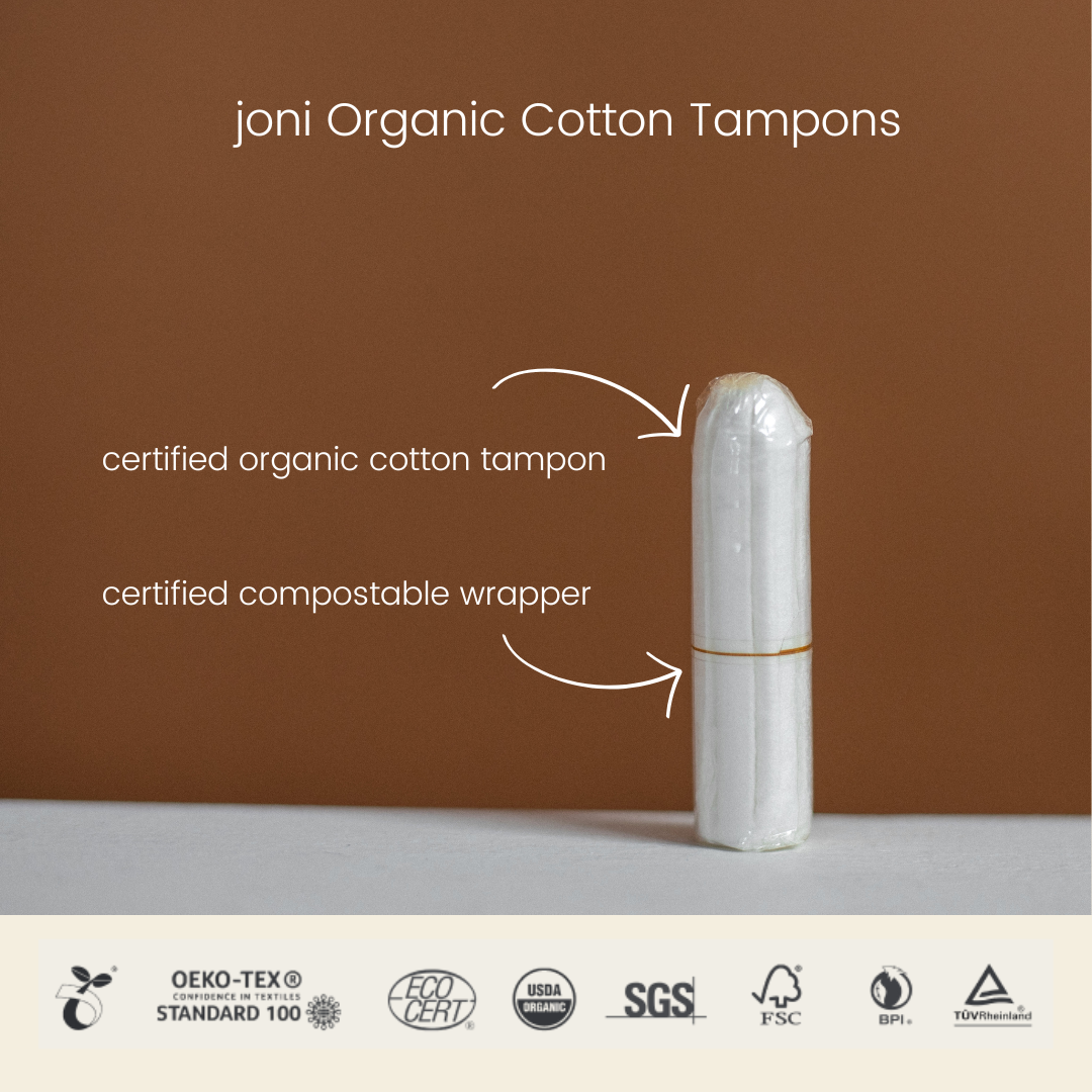 joni organic cotton tampon with certified compostable wrapper on a neutral background.