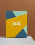 Colorful joni Mini Period Pad Pack packaging featuring geometric shapes, designed for menstrual care.