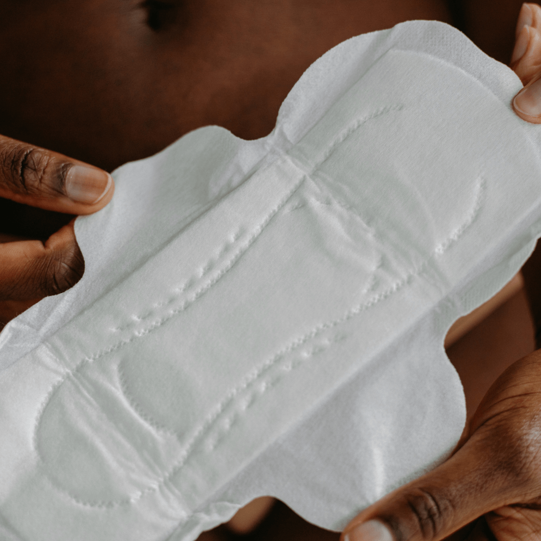 joni regular pad unwrapped and help open to show high quality and soft texture of period pad