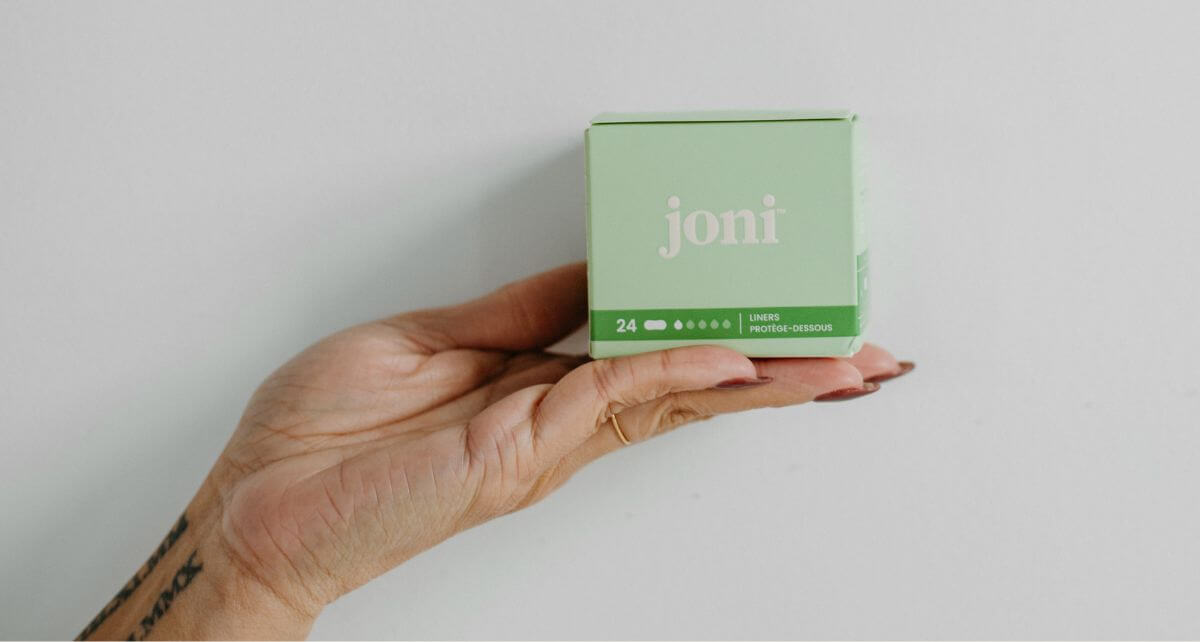 Upturned palm holds joni plant-based period liners