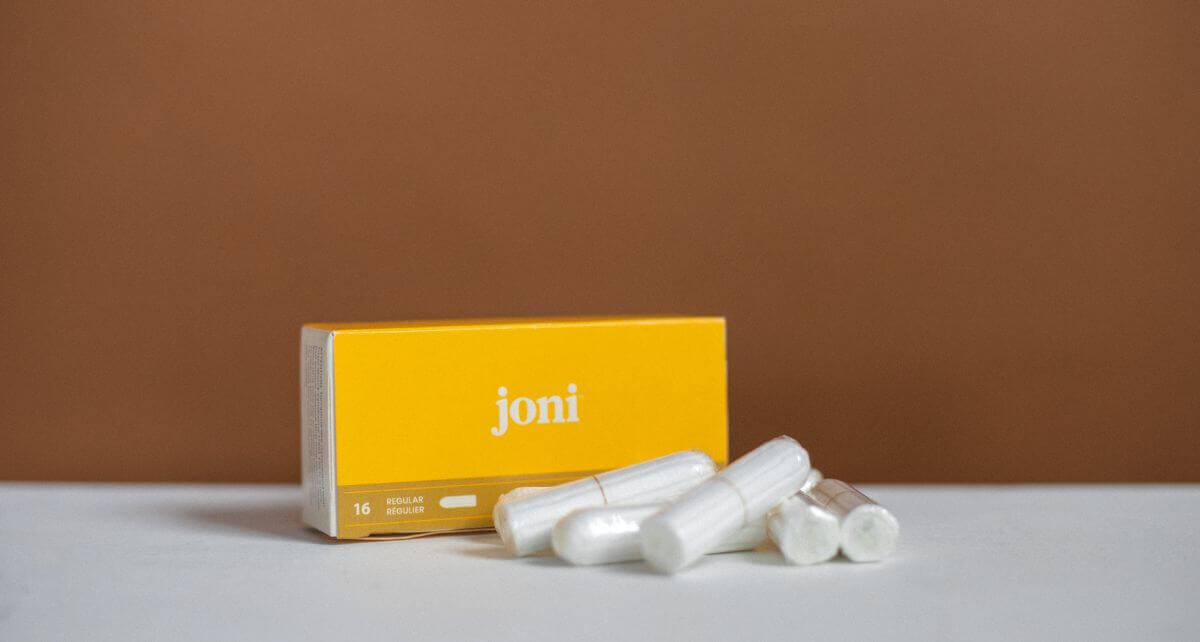 joni's regular digital tampons with a brown background