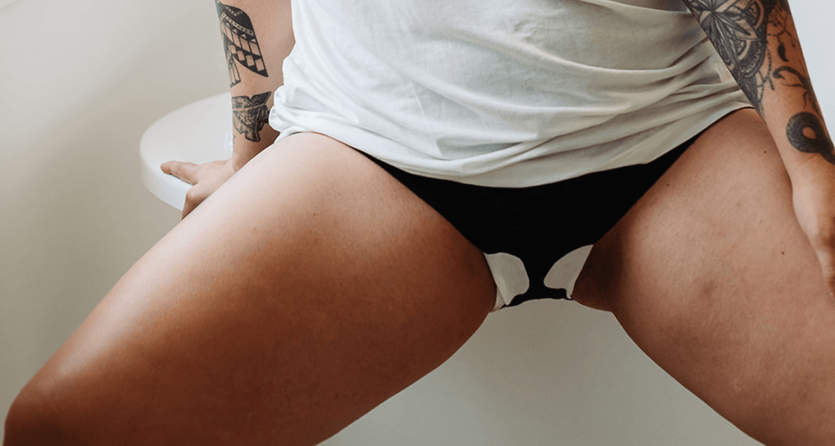 Woman in underwear with pad with wings