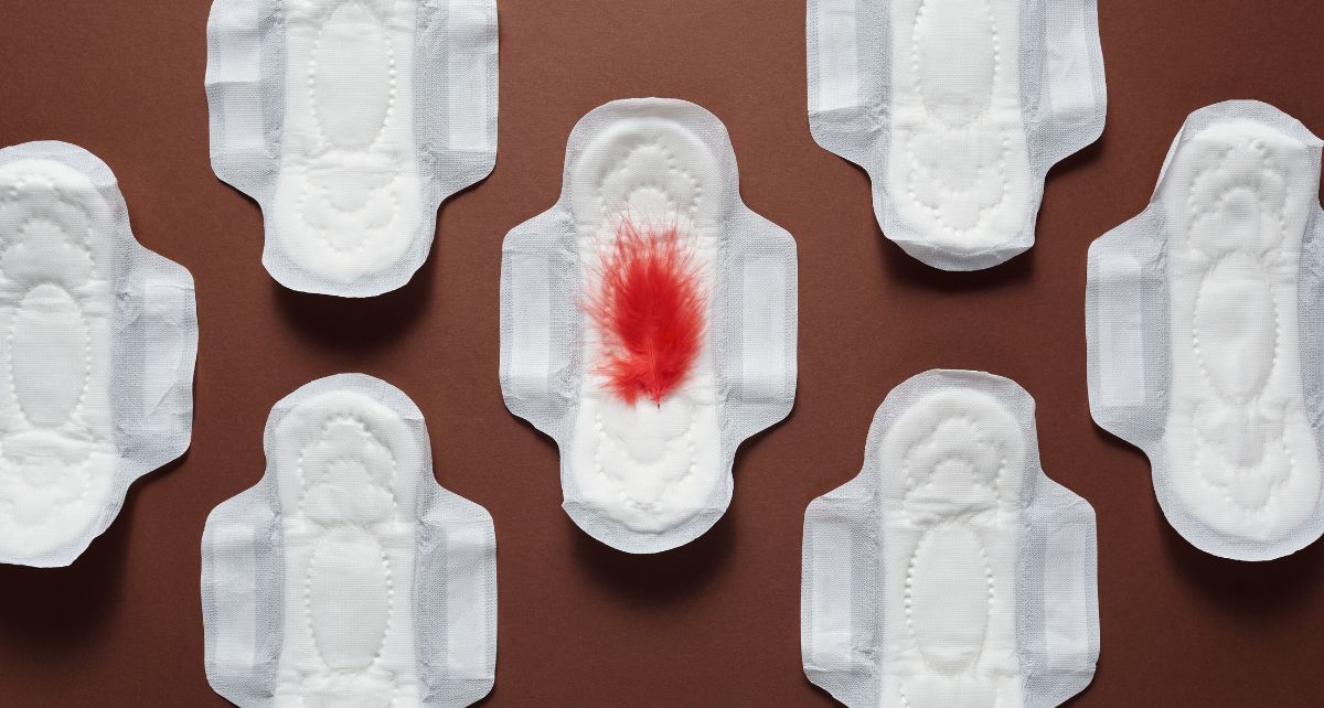 Period pads with a red feather