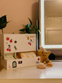 Retro Period Care Bundle displayed on a vanity with plants and a cute star plush toy.